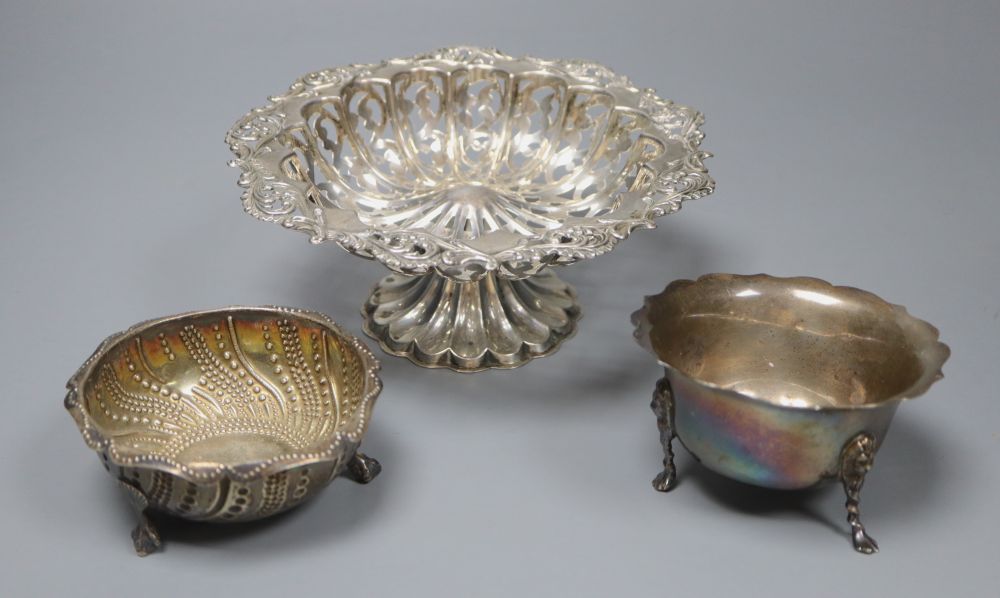 A pierced and embossed silver footed bowl, maker C.C, Chester 1907 and two silver sugar bowls, approx 13oz